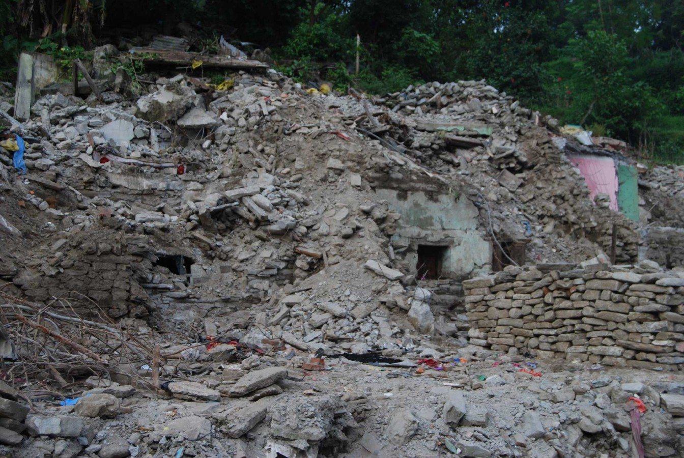 A house still buried under rubble, four months after the Nepal earthquake in Bahrabise, Sindhupalchok. There were many similar sights en route to this village, and the task that faces these villagers is more than daunting. Photo: Unnat Sapkota