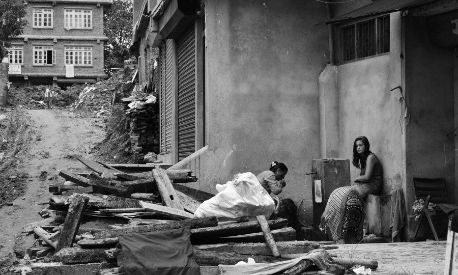 Two women in Sankhu with a water fountain