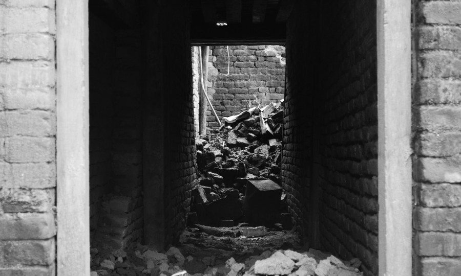 The sun shines into a tunnel of debri in Sakhu, Nepal, after the earthquake.