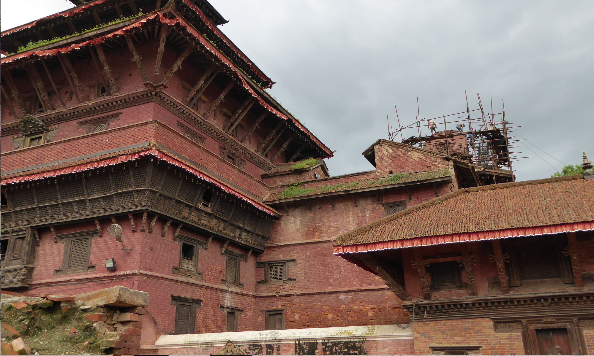 Worked continue to rebuild temples in Patan. Much of the world's media focused on the damaged and destroyed cultural heritage sites after the earthquake, giving a sense of blanket devastation across Nepal.