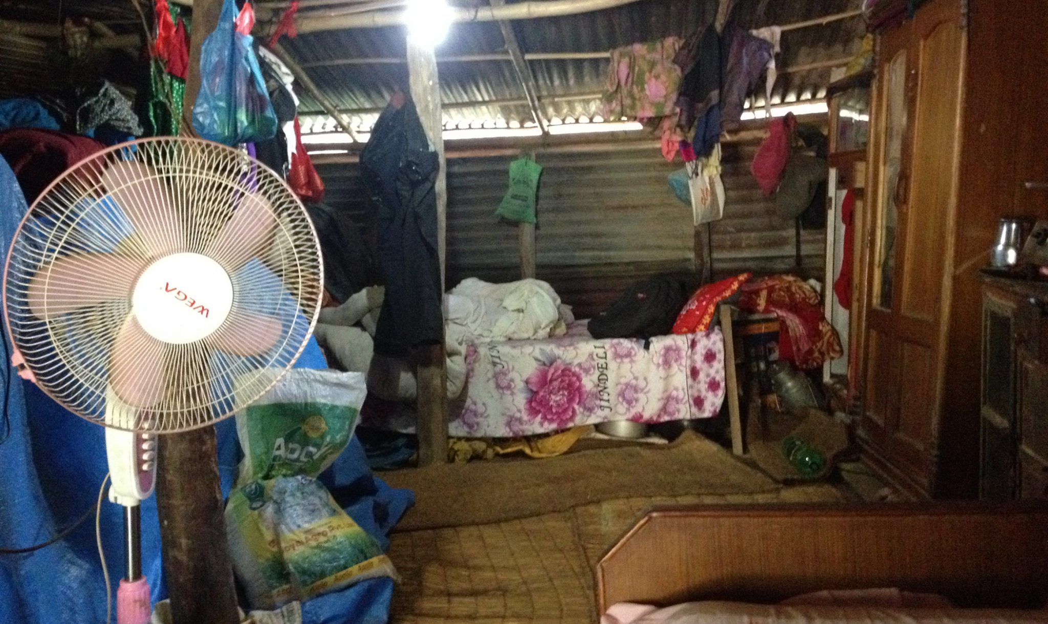 Inside the temporary shelter, which the residents built themselves from tin sheets and bamboo.