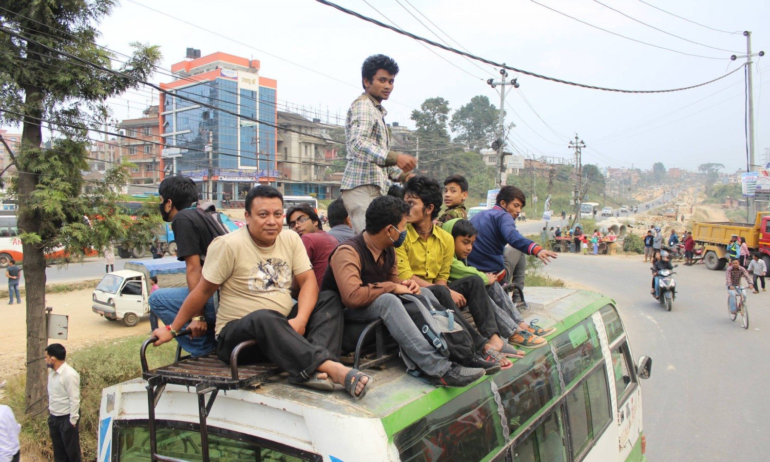 Commuters sit on the roof of a bus in Kathmandu during during the fuel crisis.