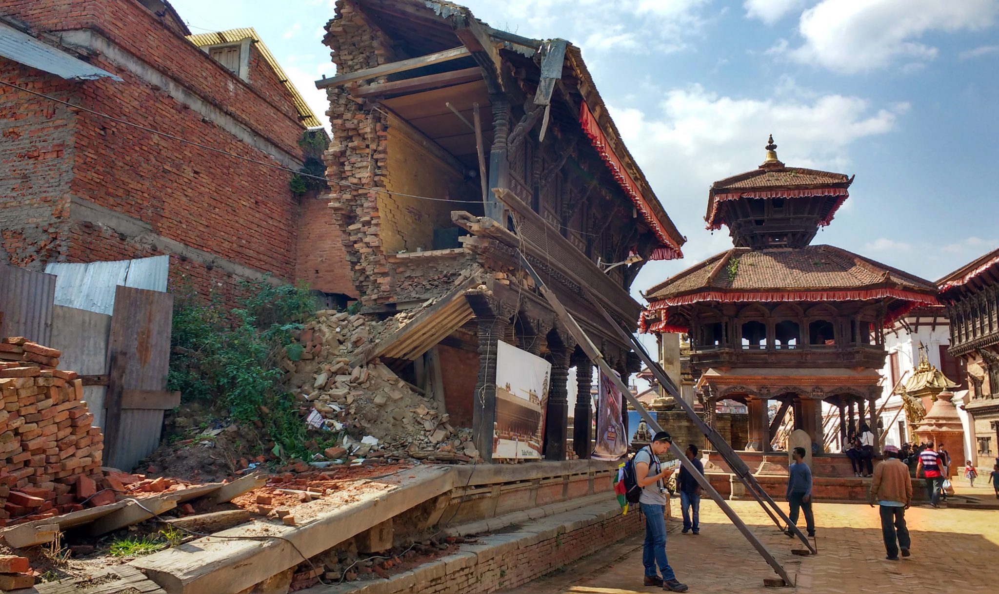 Right at the centre of Bhaktapur Durbar square lies a 15th-century palace, sections of which collapsed in the recent quake. The interior has remained closed since the 1934 earthquake. The courtyard surrounding it still lies in ruins and the uncleared debris from the broken down buildings have now become a part of the temple complex. 