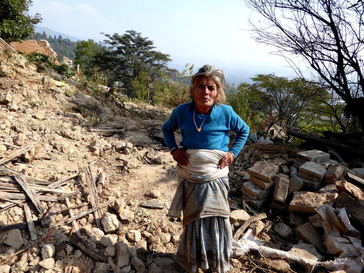 Seti Lamichhane stands in the ruins of her house in Kahvresthali
