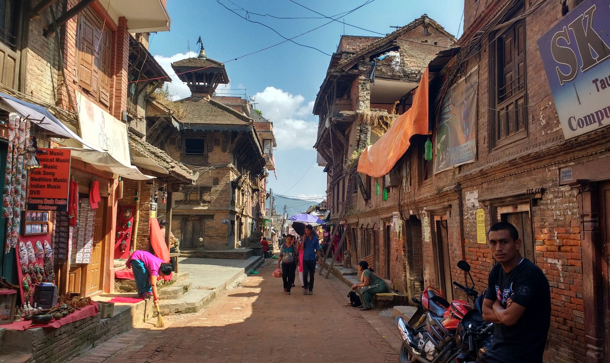 A side-street with stalls and shops for tourists