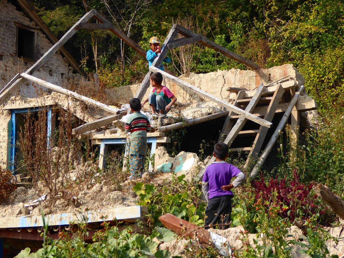 Children play among the ruins of their home in a village in Kathmandu. Thousands of earthquake victims are still waiting for government help in reconstruction. (Photo: Patrick Ward)