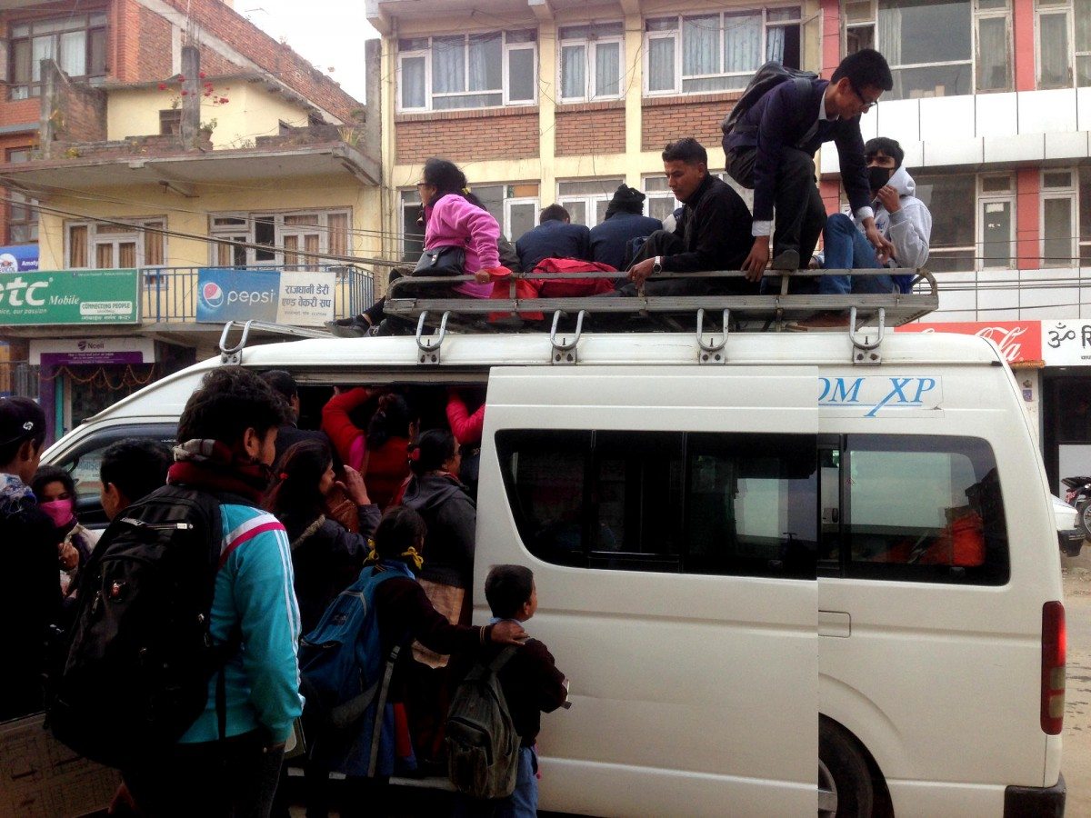 It’s not an easy school run, as people flock to the buses in the hope of squeezing themselves onboard. The brave, and desperate, scramble up the back of the bus to perch on the roof. Of course, if this bus is full (and the bus workers will only say so once every inch of space is full), there’s always the next one… Photo: Patrick Ward